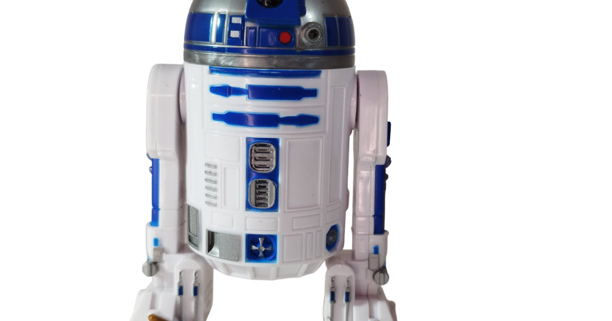 Figurine R2d2 Is Standing On A Desk Backgrounds | PSD Free Download Figurine R2d2 Is Standing On A Desk Backgrounds | PSD Free Download